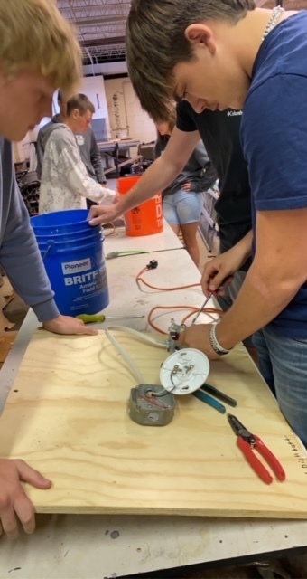 Seniors begin wiring the plug and junction box