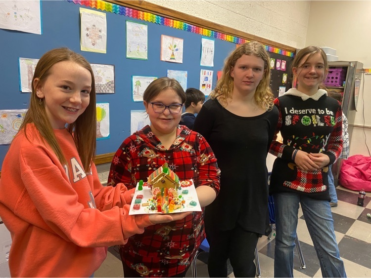 students with ginger bread house 